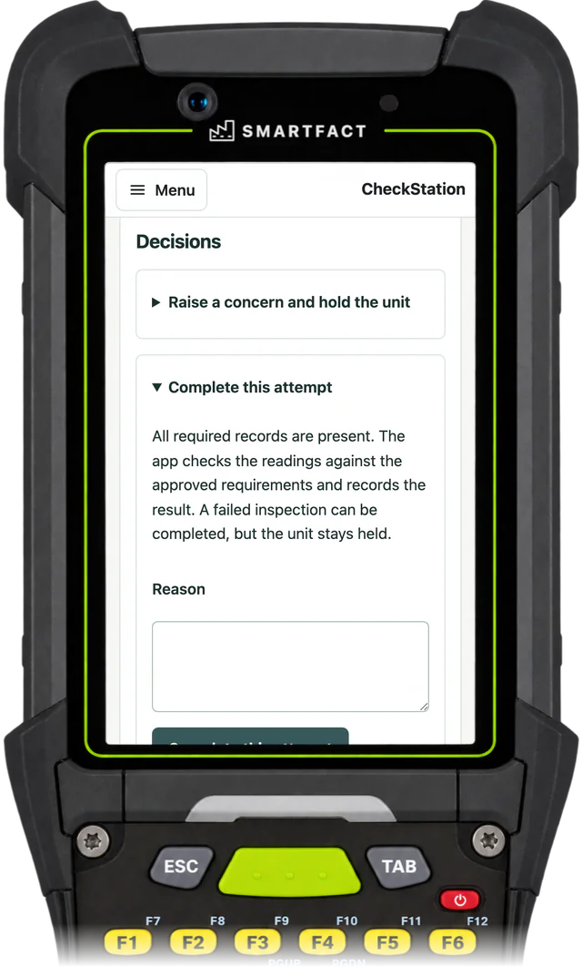 CheckStation station showing the completion panel: all required records are present, and a failed inspection can be completed but the unit stays held
